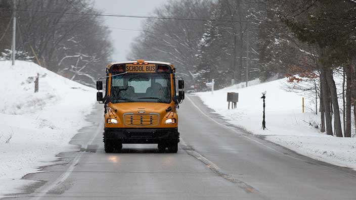 school bus in the winter - ice melting: road & highway - OxyChem calcium chloride