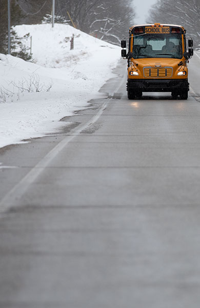 school bus in the winter - ice melting: road & highway - OxyChem calcium chloride