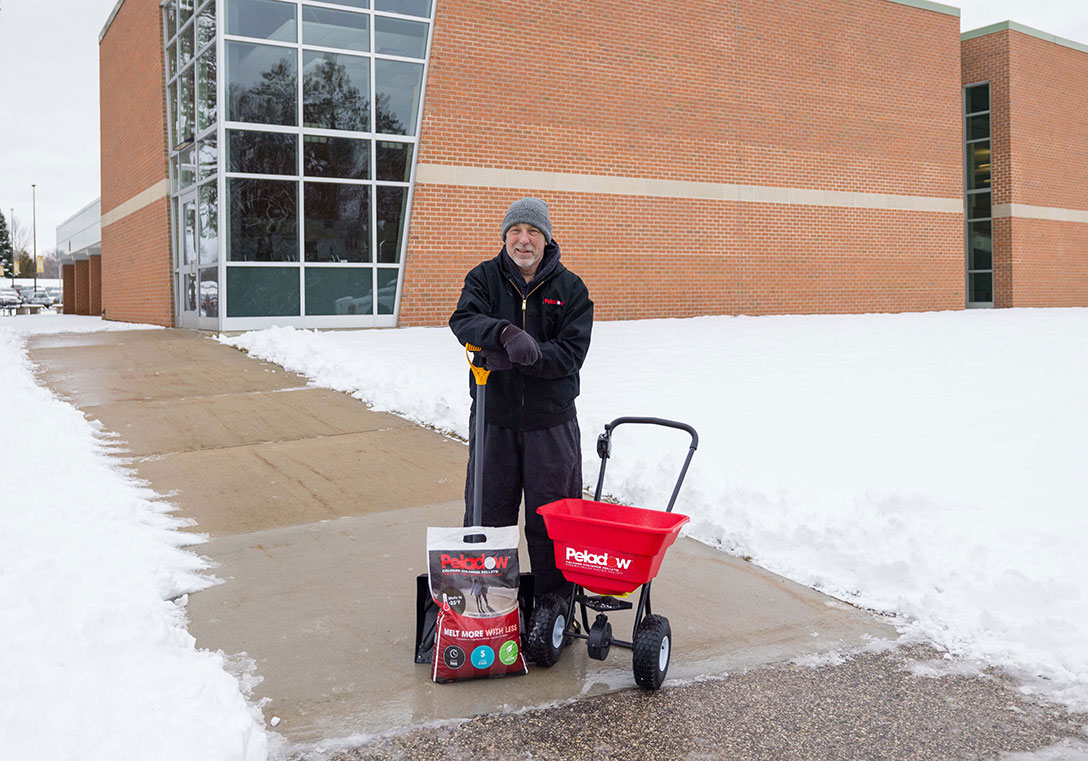 calcium chloride spreader in winter - ice melting: sidewalks - OxyChem calcium chloride