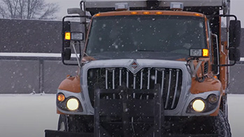 Snowplow truck filled with OxyChem Calcium Chloride